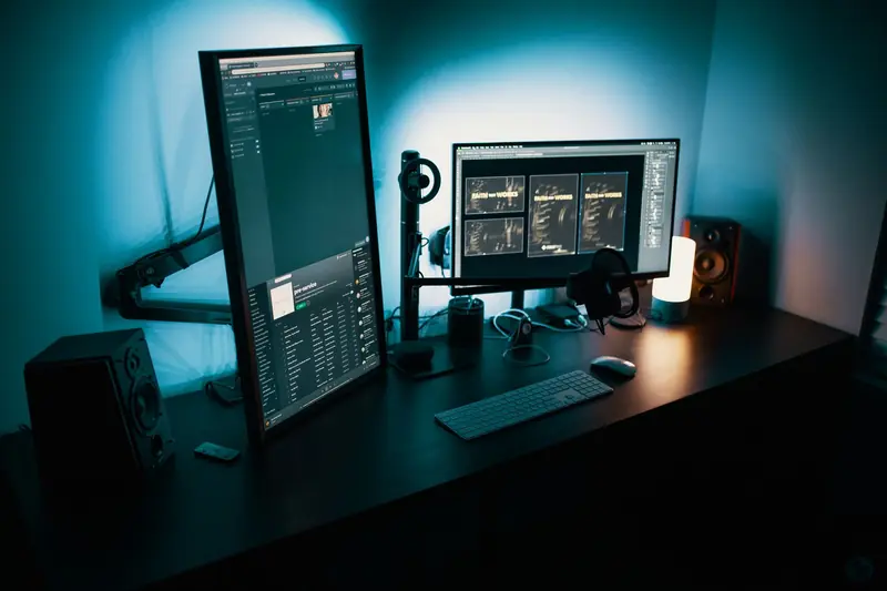 A contemporary office desk featuring a dual monitor setup with stylish lighting, ideal for tech enthusiasts